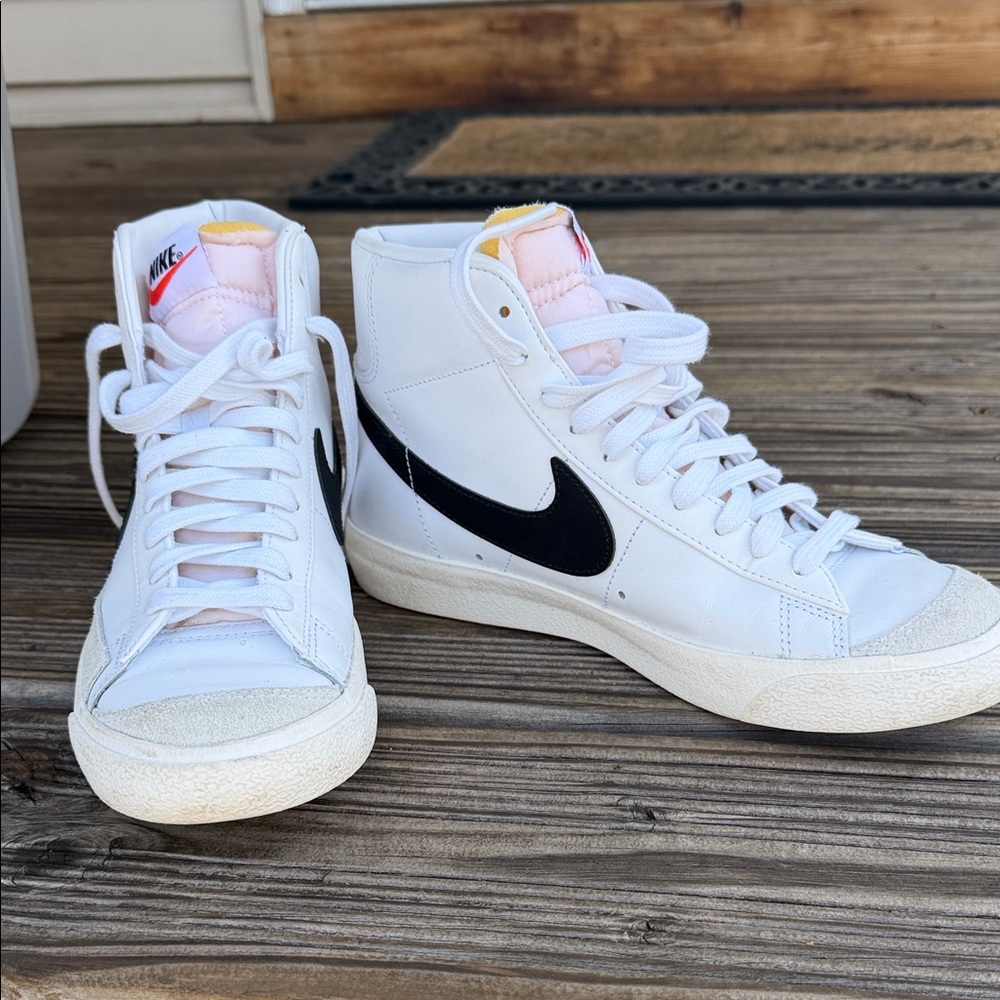 Nike White High-Top Sneakers with Black Swoosh and Pink Tongue